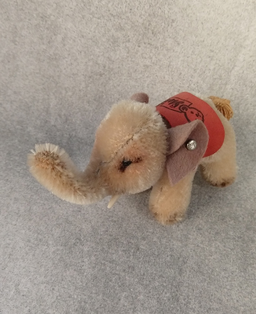 1956 gray elephant with red 'Steiff' blanket