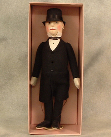 Felt gentleman in morning coat and top hat