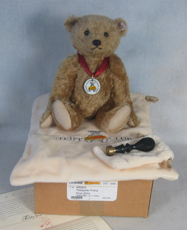 Tan teddy bear with ceramic medallion and wax seal