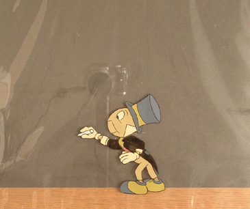 Jiminy Cricket writing with chalk from 1950s. 5" cel size. Framed. $950.00 