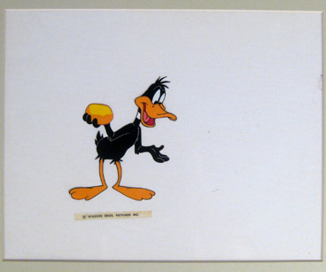 1950s Daffy Duck holding gold nugget production cel. Matted $750.00