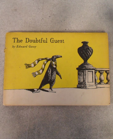 Edward Gorey's "The Doubtful Guest" with dust jacket, First British Edition, published in 1958 by Putnam & Co, Ltd $120.00