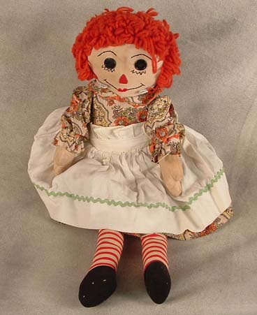 24" Handmade Raggedy Ann c.1960 in orange and white flower print dress, white pinafore w/green ric rac and button eye traditional face, arms and legs.